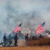 Re-enactment of Battle of Bentonville with smoke around re-enactors..