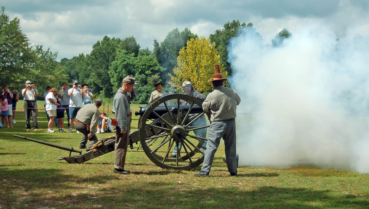 Re-enactors blowing cannon at Bentonville Battlefield.