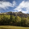 Stone mountain rising up over fall foliage at Stone Mountain State Park.