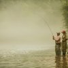 Two men fly-fishing on Watauga River in North Carolina.