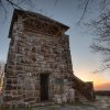 Wayah Bald Lookout Tower from its base overlooking beautiful mountains during fall.
