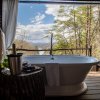 Soaking tub in treetop cabana overlooking mountain views at Lakeview at Fontana.